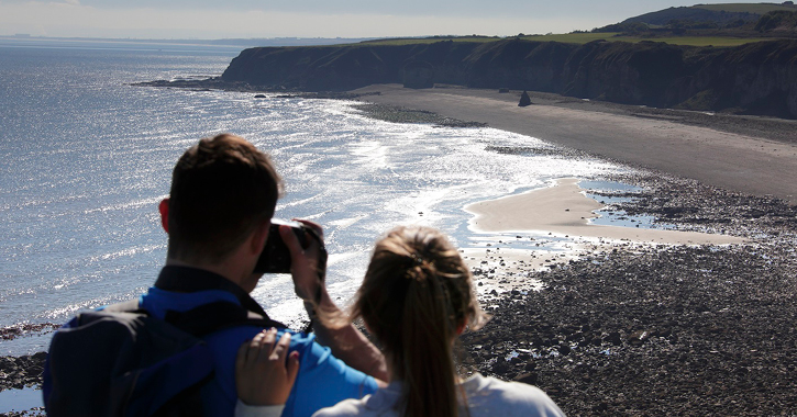 couple admiring the view at blast beach, seaham